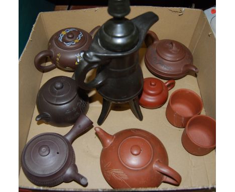 A Yixing style teapot and cover, of flattened oval form; together with various other similar examples and cups etc