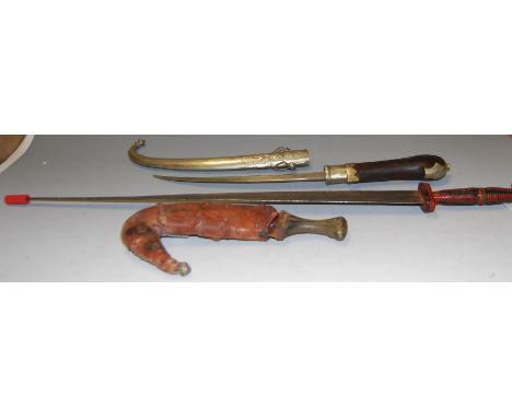 An Eastern jimbaya; together with one other similar example and an African dagger (3)