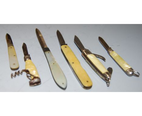 A Victorian pocket fruit knife having silver blade and mother of pearl handles, together with various other silver pocket fru