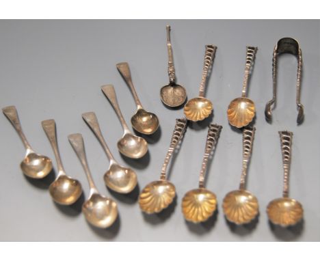 A set of six late Victorian silver coffee spoons with matching sugar tongs, each having shell shaped bowl and pierced stem, t