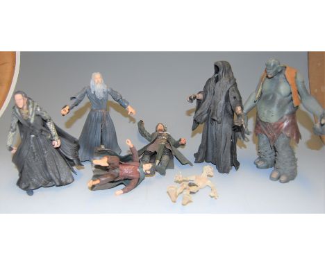 A box of assorted Lord of the Rings plastic figures etc