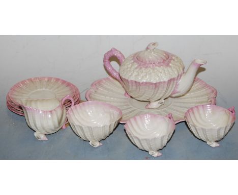 A second period Belleek Neptune two-place setting tea service, to include teapot and cover, two teacups, two saucers, a sugar