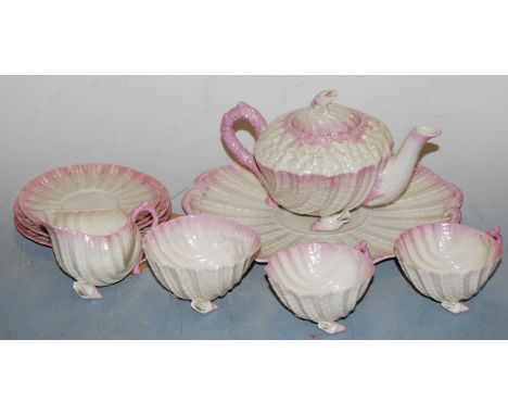 A second period Belleek Neptune two-place setting tea service, to include teapot and cover, two teacups, two saucers, a sugar