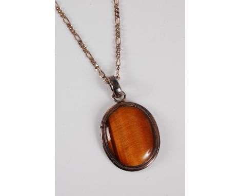 A tigers eye pendant, the oval cabochon, collet mounted, 35mm long, stamped 925, with silver chain, (21.5g), cased by Rood, B