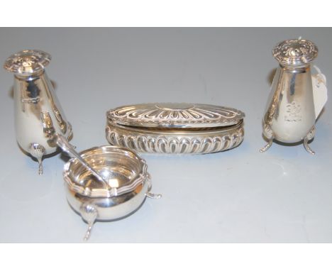 A pair of early 20th century silver pedestal pepperettes in the Art Nouveau style, together with a silver pocket snuff box, s