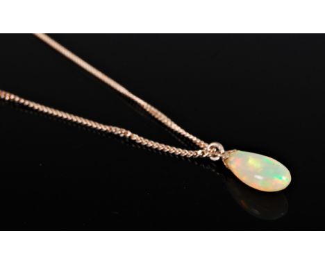 An opal pendant, the pear shaped opal, 14mm long, with silver cap and chain, (3.5g)