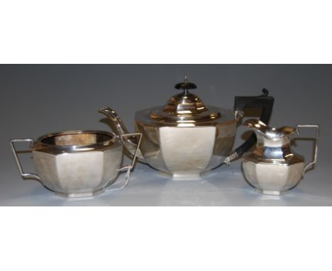 An Art Deco silver three piece teaset comprising teapot, twin handled sugar, and cream (some damage), gross weight 30.6oz, Bi