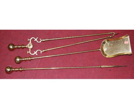 A set of Victorian turned brass fire tools, to include tongs, poker and shovel