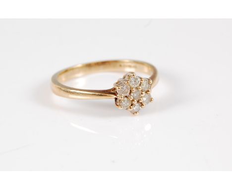 A 9ct diamond cluster ring, the flowerhead cluster of round brilliant cut diamonds, total estimated approx. 0.25cts, all claw