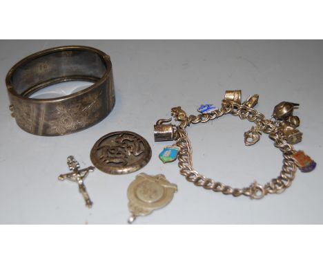 A small collection of silver and white metal items to include white metal charm bracelet with various charms, Victorian silve