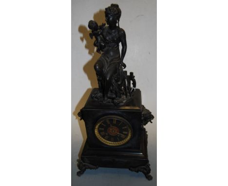 A late 19th century black slate cased mantel clock having enamel dial with gilt Roman numerals and eight day movement, the wh