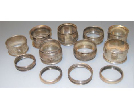 A collection of 12 assorted Victorian and later silver napkin rings, 5.1oz