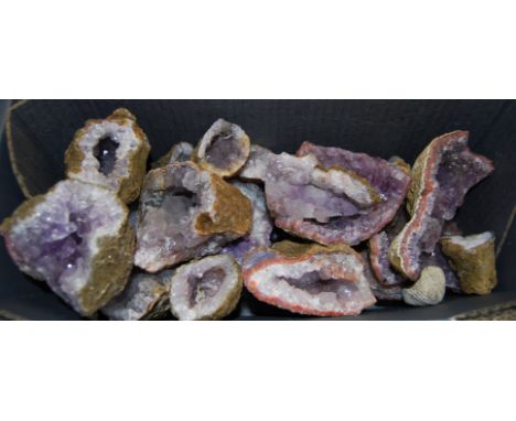 A quantity of amethyst geodes, all unpolished