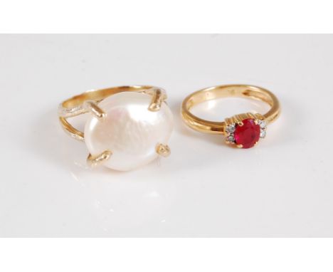 A 9ct cultured pearl ring, the large button pearl, approx. 12mm diameter, in a four claw setting, with textured band stamped 