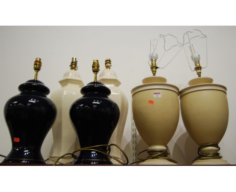Three pairs of table lamps. Shortest height to top of bayonet 43cm.One blue glazed lamp with fingernail chip to lower outer e