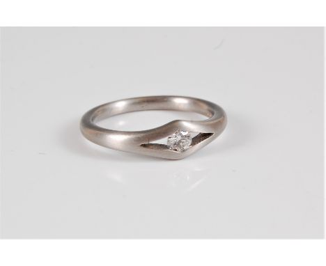 A platinum and diamond solitaire ring, the round brilliant cut diamond, estimated approx. 0.20cts, tension set in an open nav