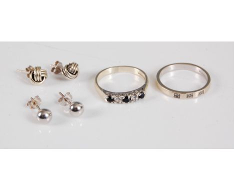 Two 9ct rings, the first a sapphire and diamond ring, stamped 375 with Birmingham assay mark, size K, and a three stone diamo