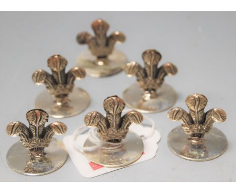 A set of 6 contemporary silver menu stands modelled as fleur de lys