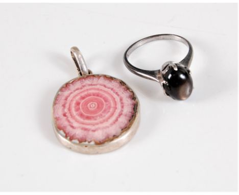 An 18k plated cats eye cabochon ring, the deep grey/brown cats eye cabochon, approx. 10mm long, size M, and a rhodochrosite p