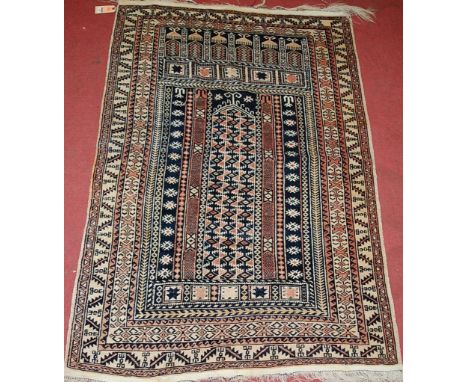 A Persian woollen rug, having boxed reserves and kelim flatweave ends; together with a vintage tan leather suitcase, with met