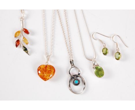 Three gemset necklaces, to include an amber heart, 18mm wide, an opal and silver necklace, and a peridot necklace, together w