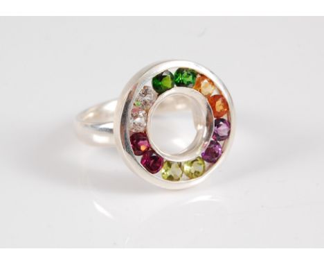 A silver and multi gemset ring, the silver circle channel set with gemstones to include amethyst, citrines, diopside, rock cr