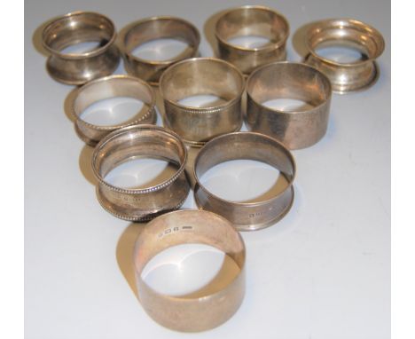 A collection of ten Edwardian and later silver napkin rings, 5oz