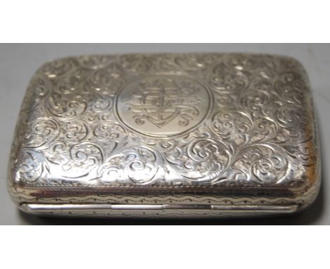 A late Victorian silver pocket cigarette case of typical form having all-over floral engraved decoration and initialled carto