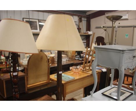 An ornate gilded wooden standard lamp and shade 