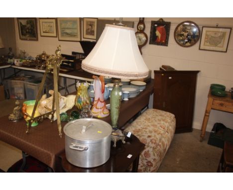 An Eastern style table, lamp and shade; and a stainless steel pan