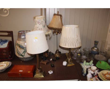 A pair of brass Corinthian columned table lamps; together with one other pair of table lamps and a single table lamp