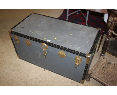 A large metal bound travelling trunk
