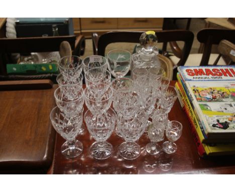 A quantity of various cut glass drinking glasses and a decanter