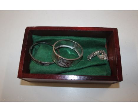 A sterling silver engraved bangle and a bracelet together with a white metal bracelet