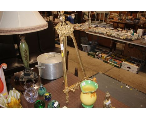 An ornate brass easel stand 