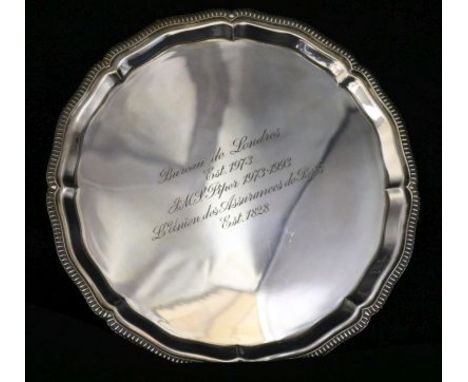 A modern silver presentation card tray