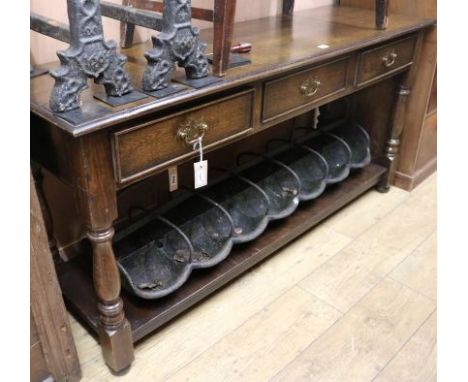 A reproduction oak dresser base, fitted three drawers and pot shelf, W.153cm