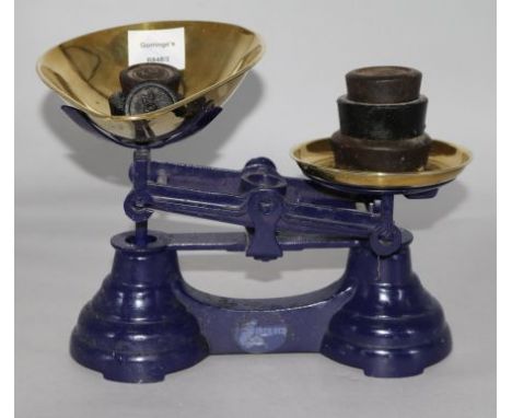 A set of Victorian black painted iron scales, with brass pans and weights