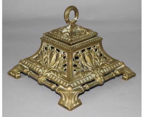 A Victorian brass inkwell