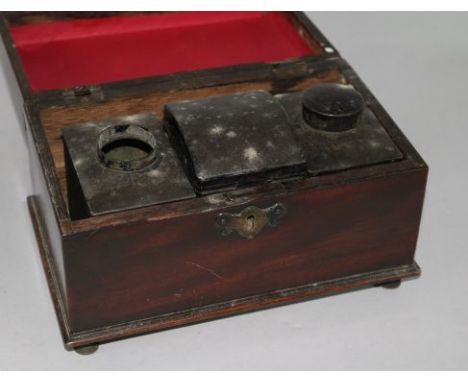 A George III mahogany tea caddy, fitted pewter tea canisters
