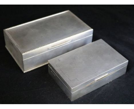 Two modern silver engine turned cigarette boxes