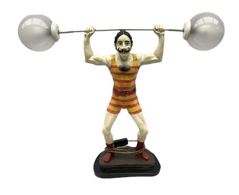 Composite table lamp, modeled as a strongman with the weights as lights, H56cm 