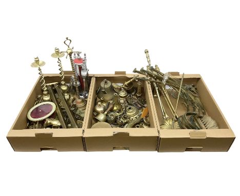 Quantity of brass to include pair of barley twist candlesticks, wall brackets, fire tools, bell, , etc