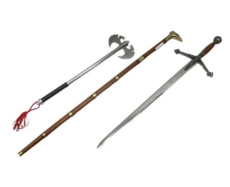 Two replica weapons, consisting of a double headed battle axe and a sword, together with a brass birdhead topped walking stic