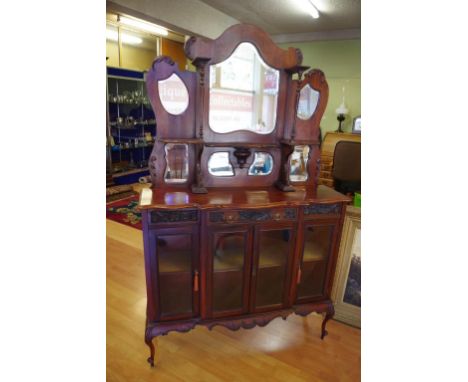 Edwardian art nouveau etagere with mirrored open shelf back above a drawer and glazed doors, 124cm wide, 201cm high