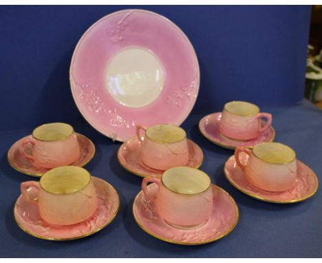 Antique Wileman & Co (Shelley) cups and saucers and a matching cake plate, with raised decorations, some hairline cracks