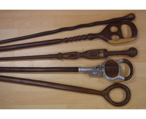 Vintage gentleman's shooting stick together with 4 assorted timber walking canes