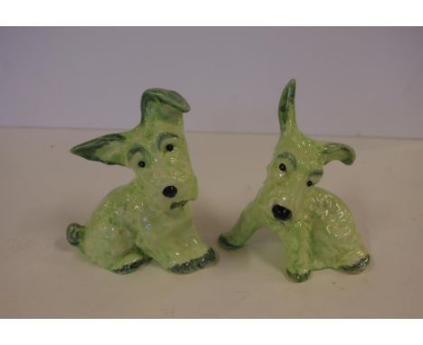 Pair of Wain Melba Ware dog figurines in green hues, 13.5 cm high