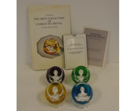 Four Baccarat "Royal Cameos In Crystal" paperweights, 7 cm diameter, 4.5 cm high, each with a display stand, together with bo