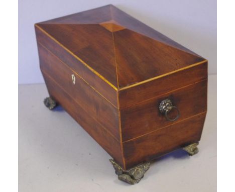 Georgian sarcophagus shape tea caddy on four brass feet, with lions head brass handles, W31cm X D17cm X H19.5cm approx